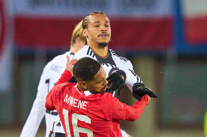 Leroy Sane pictured shoving Phillipp Mwene in the face during Germany's 2-0 loss to Austria in November 2023